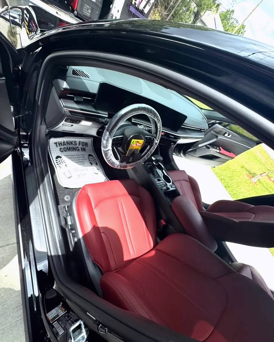 A sports car interior with red leather, detailed by GaliGloss