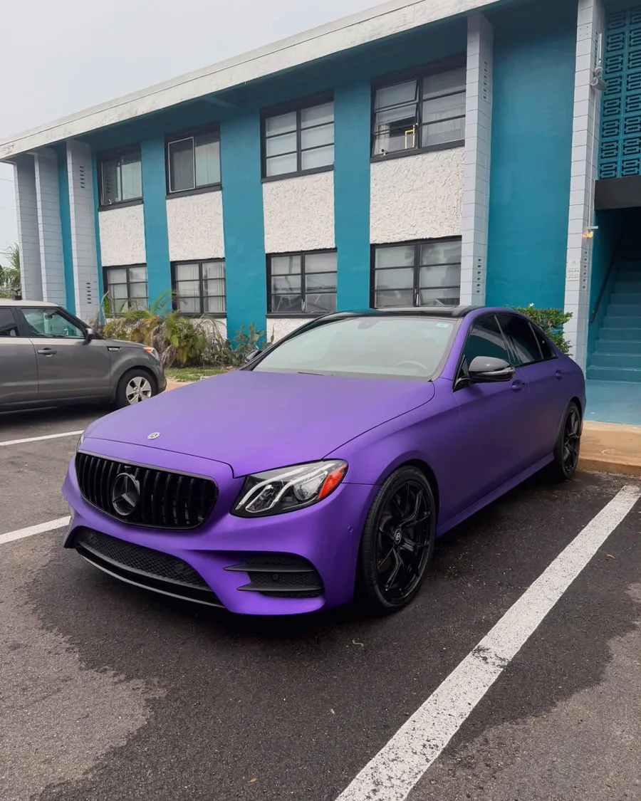 A Mercedes E-Class in a matte purple wrap, detailed by GaliGloss