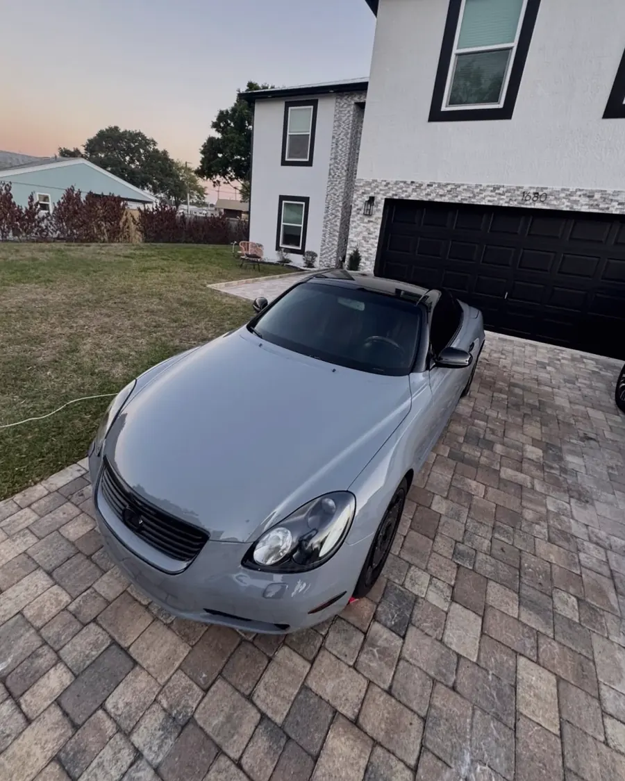 A silver Lexus SC convertible at sunset after a full detail