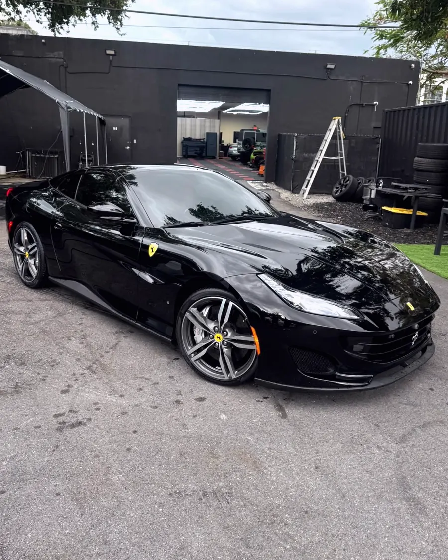 A black Ferrari detailed at the GaliGloss studio