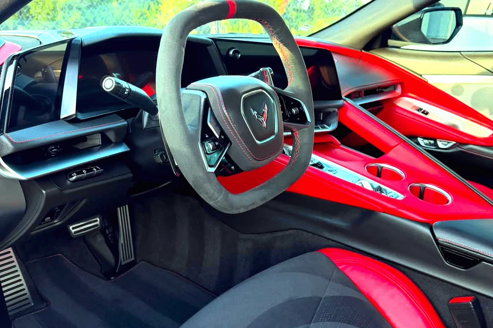 The red and black interior of a Chevrolet Corvette detailed by GaliGloss